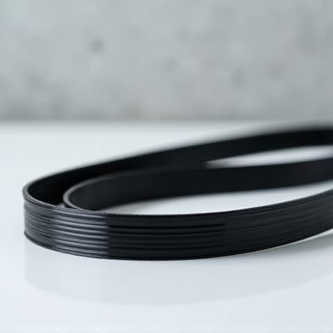 Dryer belt replacement service in Carmichael. A close-up view of a technician replacing the drive belt of a dryer during a repair service in Carmichael, CA. This image highlights the common repairs performed and the careful handling of dryer components.